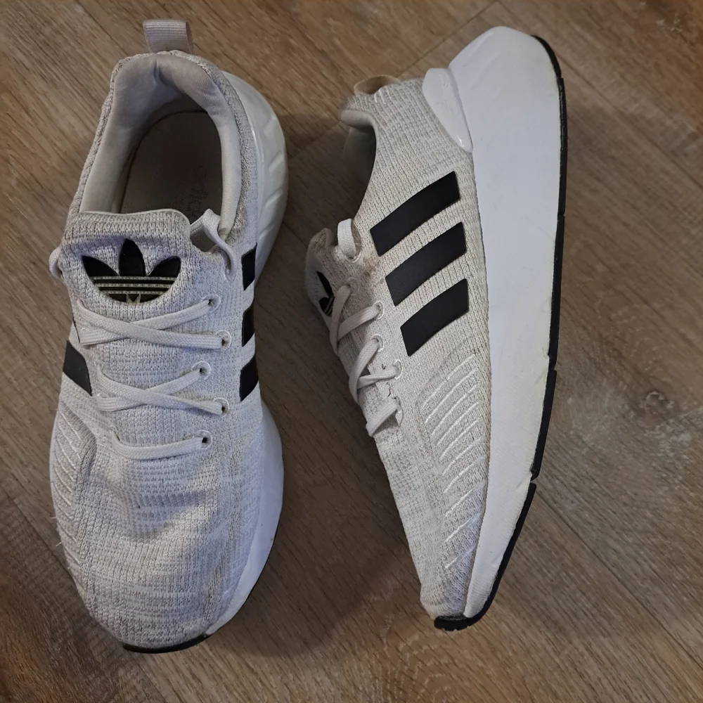 Adidas Kids' White Athletic Sneakers with Black Stripes